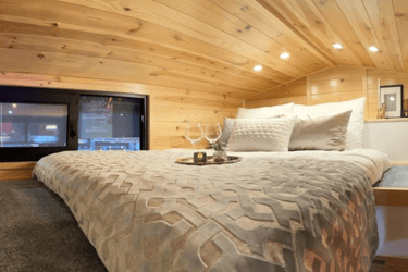 Tiny house double bed in the gallery 