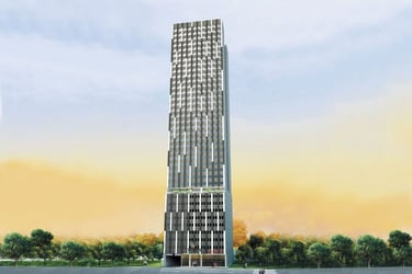 Modern high-rise residential apartment buildings with luxury balconies against a sunset sky.