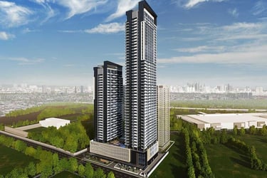 Modern luxury high-rise condominium towers in a metropolitan city skyline with lush green surroundings.