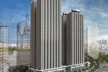 Modern high-rise residential twin towers in a luxury urban development with a city skyline background.