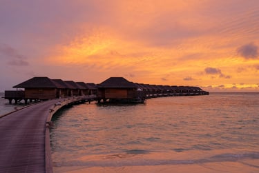 Hurawalhi Maldives sunset overwater villas