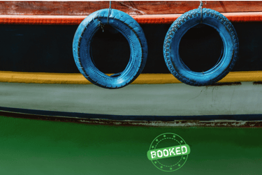 a boat with two tires on the water
