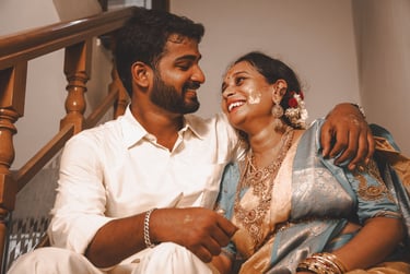 a man and woman sitting on a couch