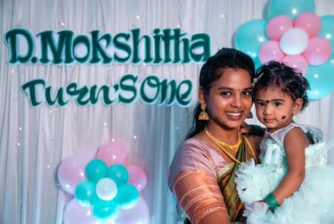 a woman holding a baby in her arms