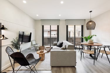 Bright living room with big windows and contemporary interior design, black accents and modern touch