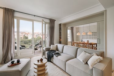 Elegant living room with bespoke wall installation, neutral tones, and subtle textures by SAVIA
