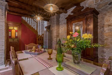 Dining area for up to 6 guests with vintage furniture in traditional stone house Villa Galanoussa
