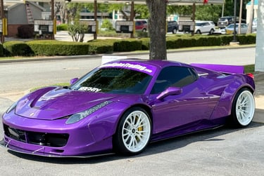 a purple car parked on the side of a street
