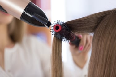 Hair model with voluminous blow-dry style