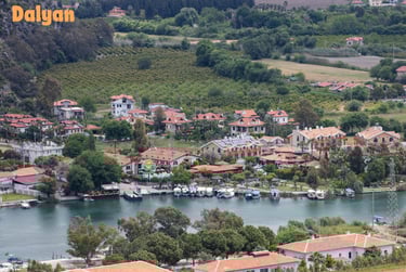 a small town with a river and a boat in the water