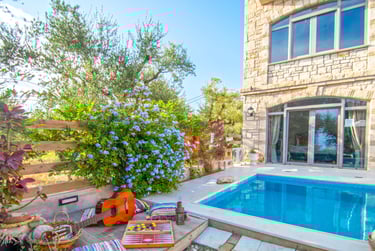 a pool with a leisure and a patio area