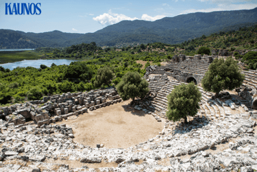 a large stone structure in Kaunos with a lake in the background, best places to visit in Dalyan