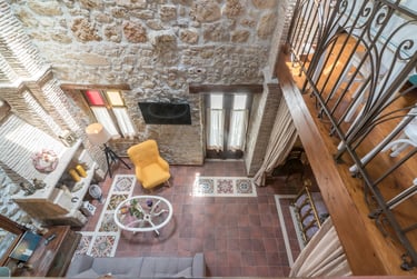 open space interior of two floor stone house Villa Galanoussa Zakynthos