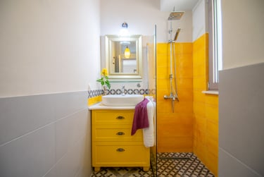 yellow bathroom tiles in holiday villa 