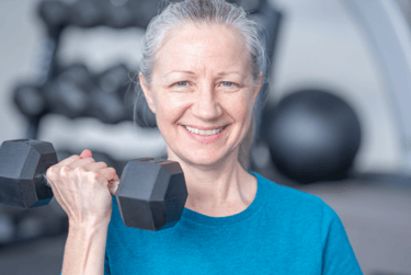 a woman doing strength training with a dumbbell in her hand
