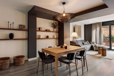 Stylish dining area with contemporary furniture, neutral tones, and a cozy interior design by SAVIA