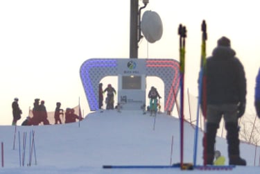 a group of people skiing down a snowy slope