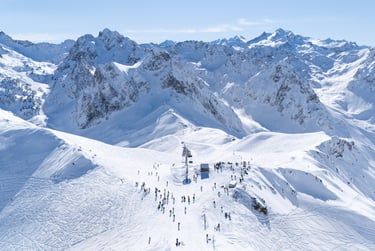 a group of people skiing down a mountain