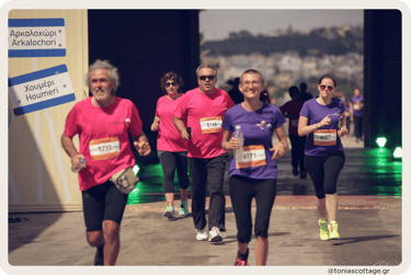 Runners participating in the Crete Half Marathon, moving with determination along the route