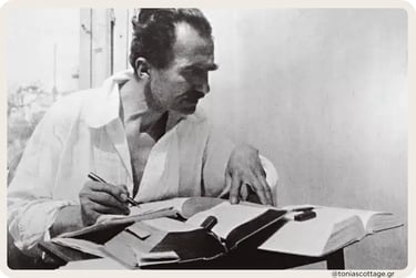 Black and white picture of Nikos Kazantzakis writing, capturing a moment of his creative proces