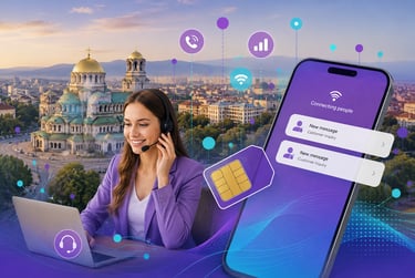 Customer support agent with headset using a laptop and smartphone for global connectivity in Sofia, Bulgaria.