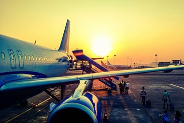 Jet airliner on runway with sunset background