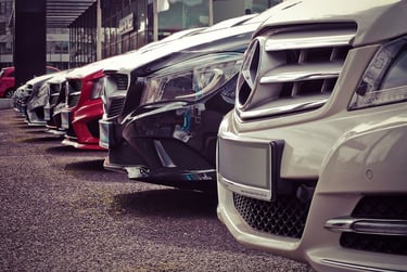 Luxury cars parked outside