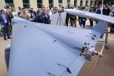 Pete Hegseth looks at LUCAS drone in Pentagon event on 16 July 2025, where 18 american drones presented