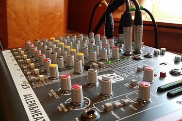 small audio mixer with connected cables