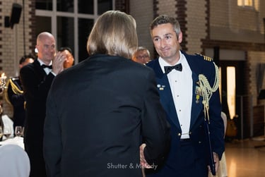 Ben Poxon receiving an award from Ambassador Philip Green.