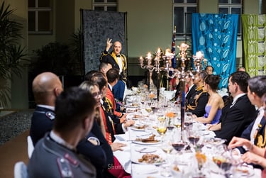 Speaker addressing guests at the Navy Candlelit Dinner at The Australian Embassy.