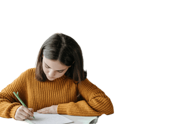 a woman in a yellow sweater is writing