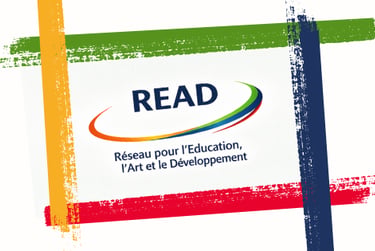 READ logo for the Network for Education Art and Development with colorful paint brush strokes.