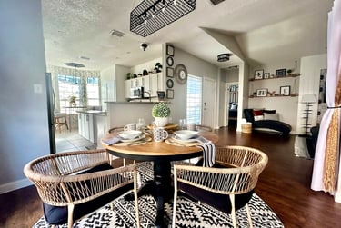 Luxury vacation rental photo gallery – bright dining room with natural light and cozy boho-inspired