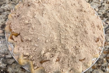 peach pie with bourbon reduction and crumb topping