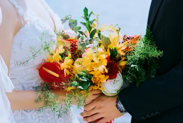 Wedding couple with a bouquet of flowers