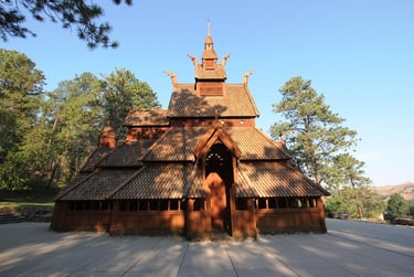 a wooden structure with a wooden roof and a wooden door
