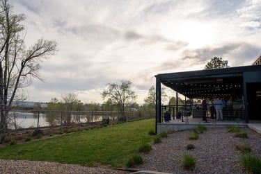 A side view from the outside of the covered patio at Gather at Lakeside showing the lake view