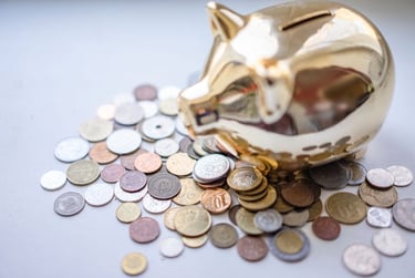 golden piggy bank and coins representing savings and saving money for financial goals and retirement