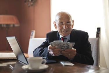 retired individual holding money symbolizing his retirement savings and wealth