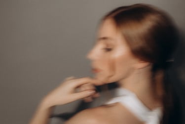 a woman in a white dress and a black tie