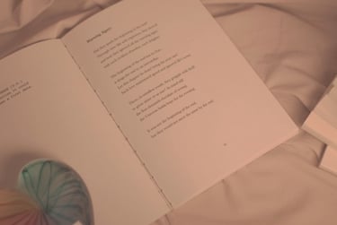 Flat lay page of J.R. Sonder's book TMFL with a rainbow glass heart over it