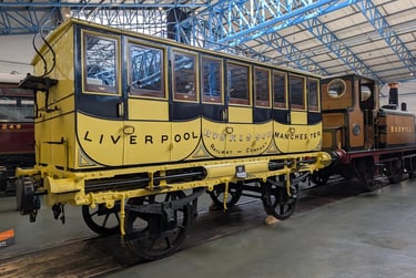 a view of a very old railways carriage in the national railway museum in York