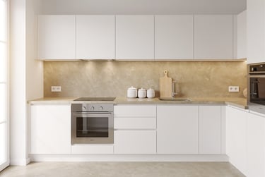 Modern minimalist white kitchen with handle-free cabinets, built-in oven and beige stone backsplash.