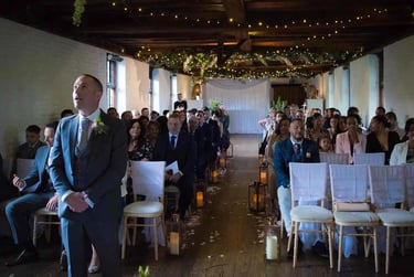 Groom waiting for his bride to walk up the aisle