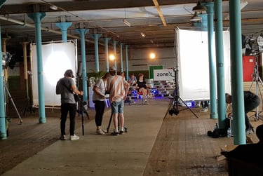 Film production crew creating content in the main room at Atlas Studios