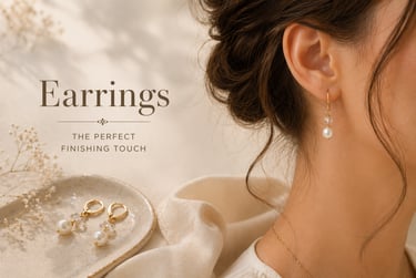 Elegant gold drop earrings with white pearls and crystals worn by a woman with a bridal updo.