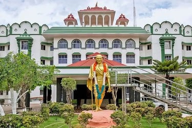 Madras high court building in Tamil Nadu with Gandhi statue at entrance