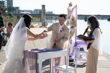 sunny day wedding couple lighting candle 
