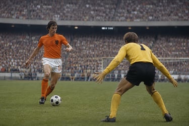 Johan Cruyff dribbles a soccer ball toward a goalkeeper during a historic match for the Netherlands.